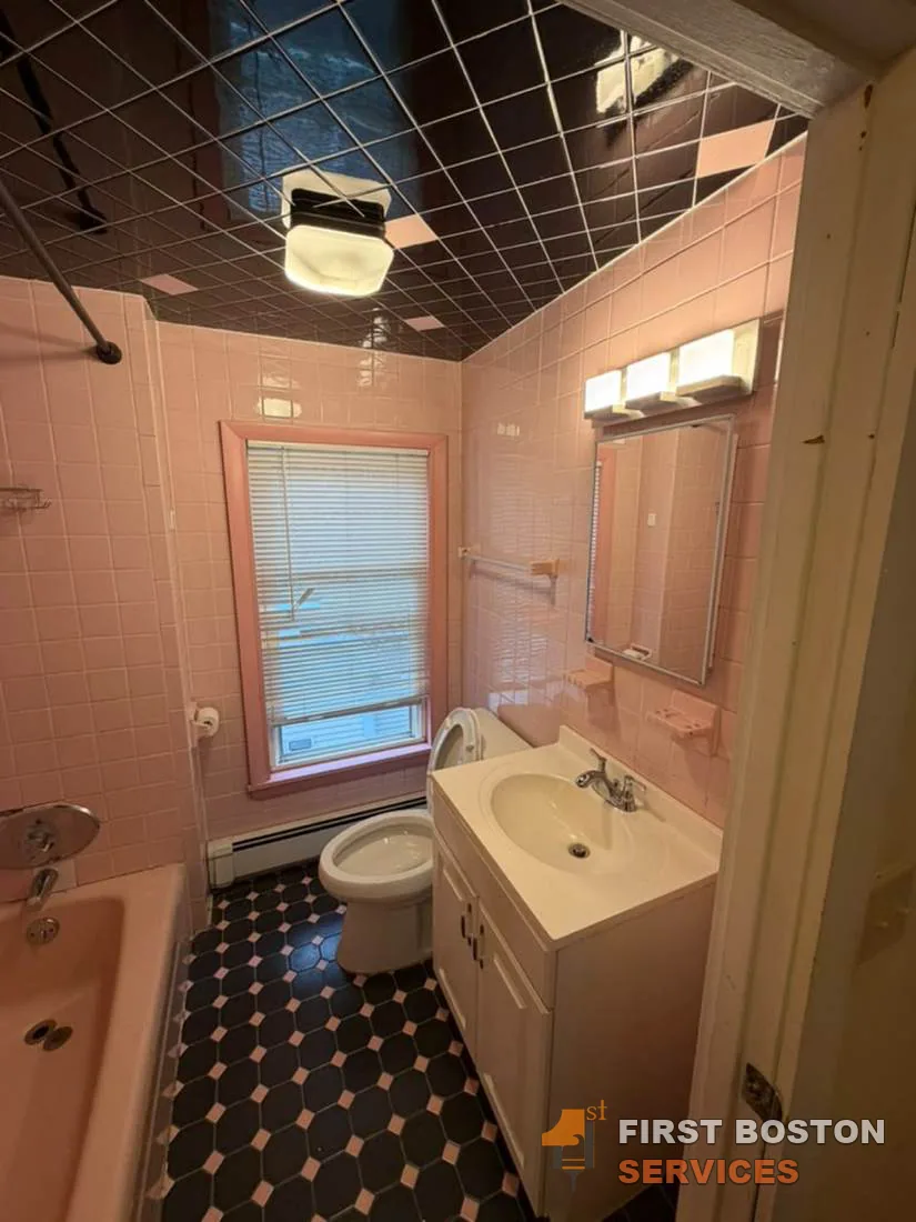 First Boston Services: Bathroom before: pink tile and fixtures