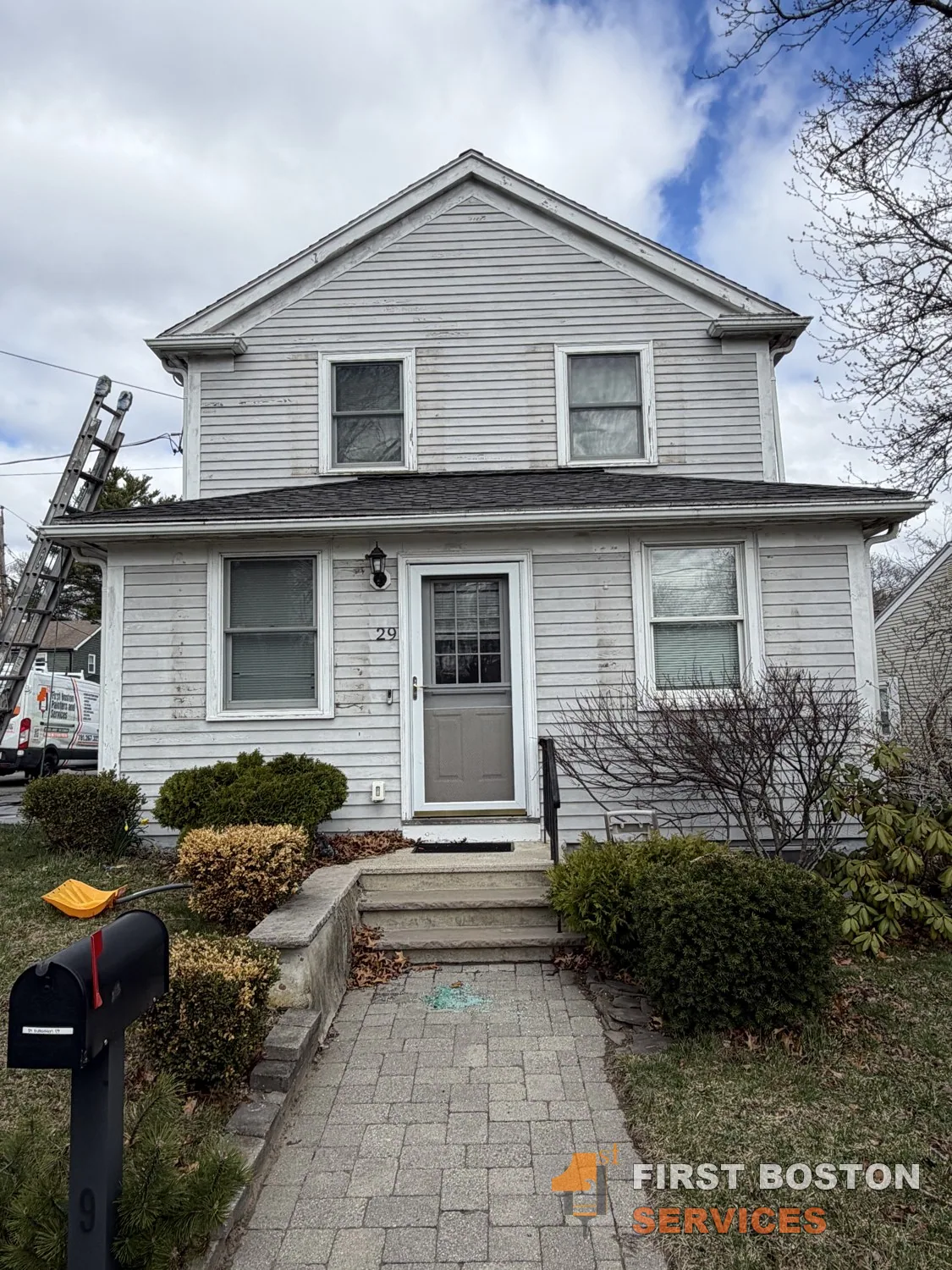 First Boston Services: Front of the house before: white siding and red shutters