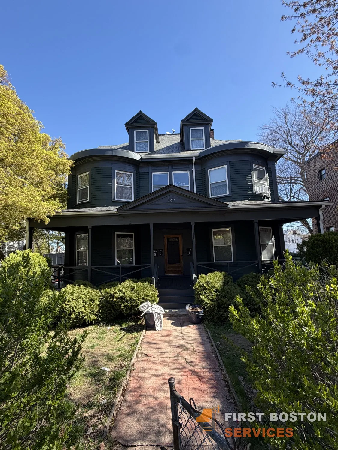 First Boston Services: Street view after: deep green with white trim