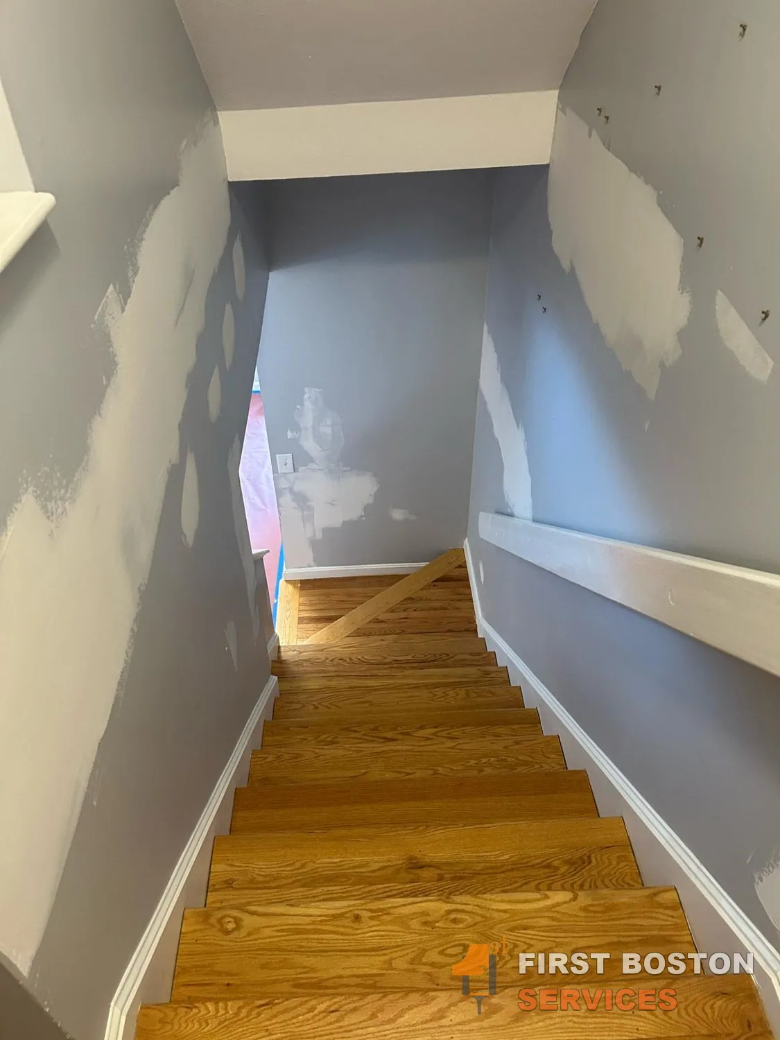 First Boston Services: Stairwell with wall repairs