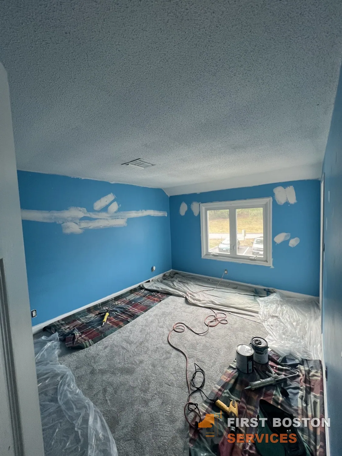 First Boston Services: Blue bedroom with wall repairs