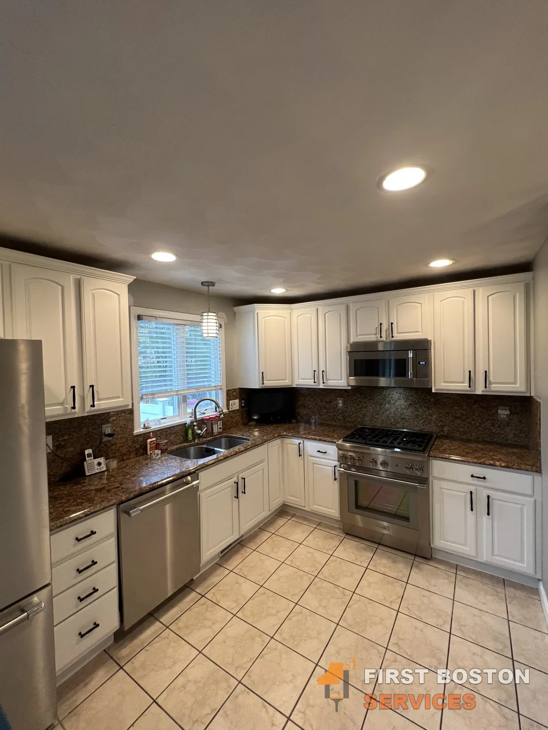 First Boston Services: Kitchen after: white cabinets
